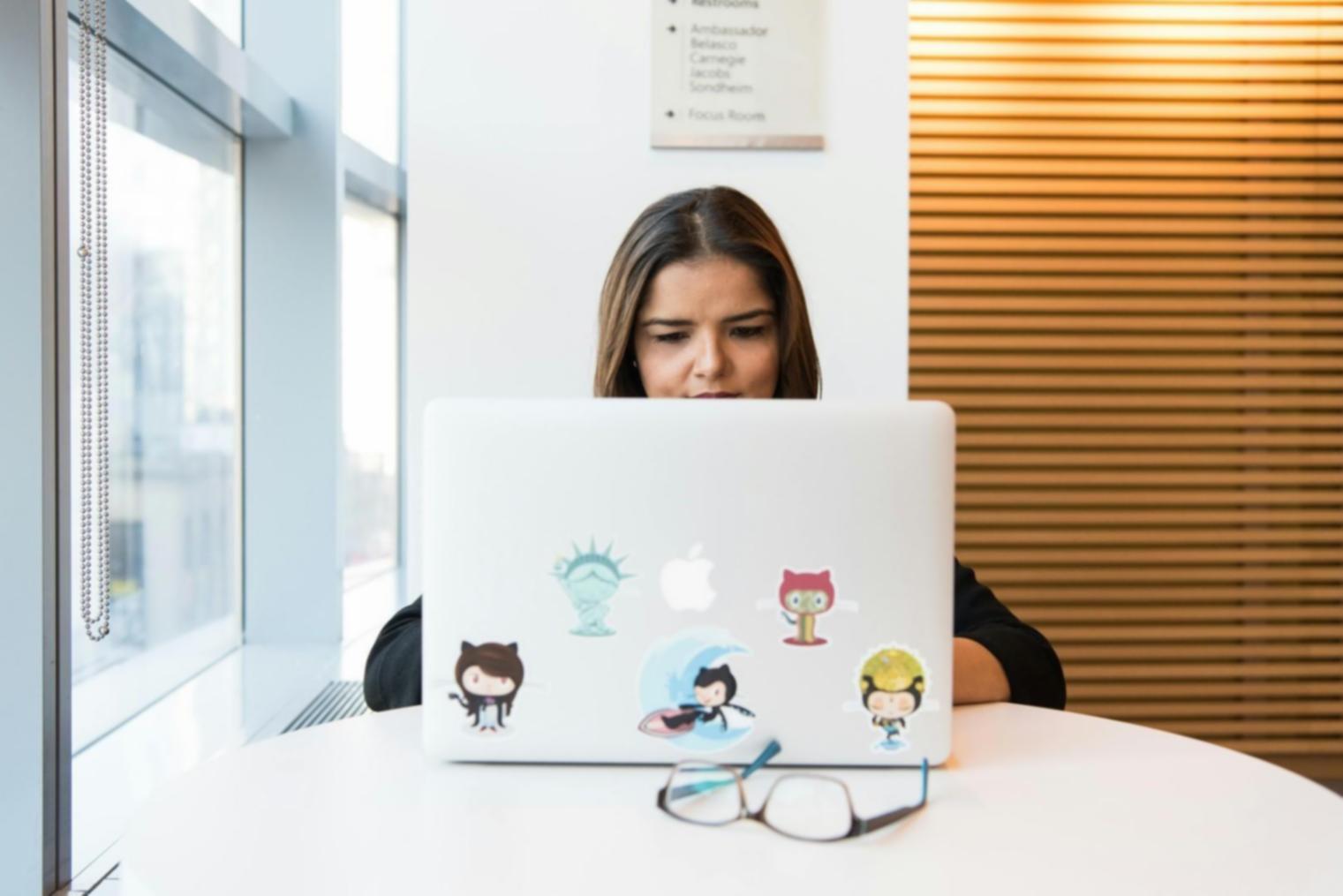 Modern mobile game development workspace with multiple devices and development tools